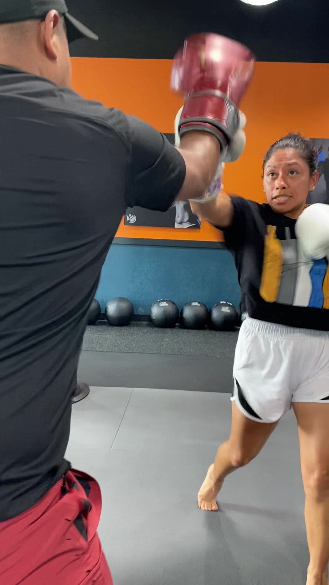 Vibes Lifestyle member working a conditioning drill with a coach